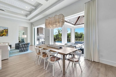 This stunning single-story residence, built in 2023, showcases on The Golf Club At Fiddlers Creek in Florida - for sale on GolfHomes.com, golf home, golf lot