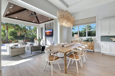 This stunning single-story residence, built in 2023, showcases on The Golf Club At Fiddlers Creek in Florida - for sale on GolfHomes.com, golf home, golf lot