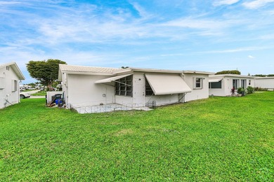 Welcome to this charming and worry-free 2-bedroom, 1-bath on Leisureville Community Golf Course in Florida - for sale on GolfHomes.com, golf home, golf lot