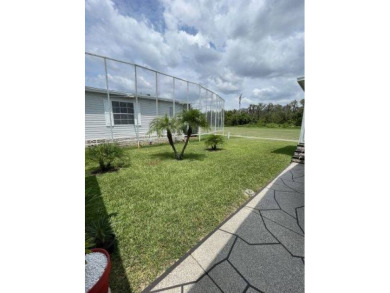 This three-bed, two-bath beauty is spacious and clean with on Four Lakes Golf Club in Florida - for sale on GolfHomes.com, golf home, golf lot