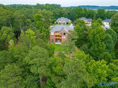 Custom-built executive golf course home featuring lake view & on Gunters Landing in Alabama - for sale on GolfHomes.com, golf home, golf lot