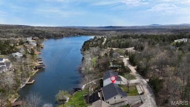 Nestled along the shoreline in a serene lake community, this on Terre Du Lac Golf and Country Club in Missouri - for sale on GolfHomes.com, golf home, golf lot