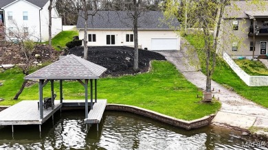 Nestled along the shoreline in a serene lake community, this on Terre Du Lac Golf and Country Club in Missouri - for sale on GolfHomes.com, golf home, golf lot