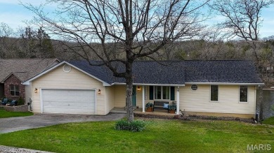 Nestled along the shoreline in a serene lake community, this on Terre Du Lac Golf and Country Club in Missouri - for sale on GolfHomes.com, golf home, golf lot