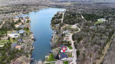 Nestled along the shoreline in a serene lake community, this on Terre Du Lac Golf and Country Club in Missouri - for sale on GolfHomes.com, golf home, golf lot