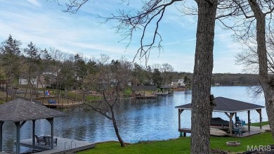 Nestled along the shoreline in a serene lake community, this on Terre Du Lac Golf and Country Club in Missouri - for sale on GolfHomes.com, golf home, golf lot