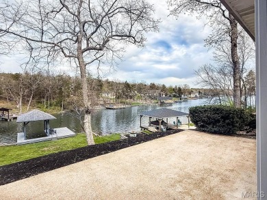 Nestled along the shoreline in a serene lake community, this on Terre Du Lac Golf and Country Club in Missouri - for sale on GolfHomes.com, golf home, golf lot