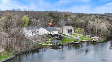 Nestled along the shoreline in a serene lake community, this on Terre Du Lac Golf and Country Club in Missouri - for sale on GolfHomes.com, golf home, golf lot