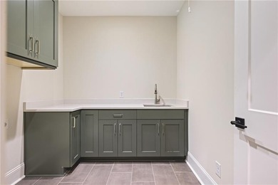 This newly built residence quietly impresses with an everyday on The Governors Towne Club in Georgia - for sale on GolfHomes.com, golf home, golf lot