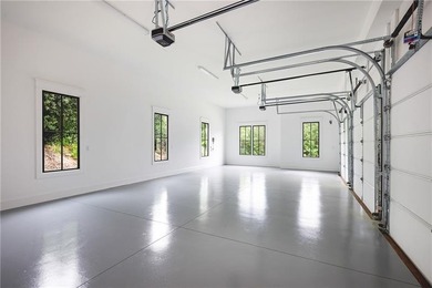 This newly built residence quietly impresses with an everyday on The Governors Towne Club in Georgia - for sale on GolfHomes.com, golf home, golf lot