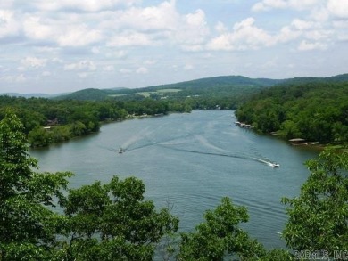 This wooded 0.52 acre lot overlooks the picturesque view of the on Diamondhead Golf and Country Club in Arkansas - for sale on GolfHomes.com, golf home, golf lot