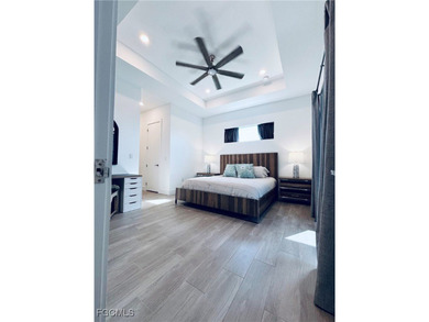 Experience elevated coastal luxury in this impeccably designed on Burnt Store Golf Club in Florida - for sale on GolfHomes.com, golf home, golf lot