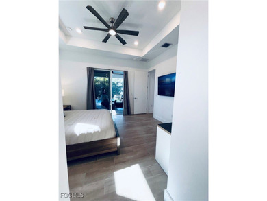 Experience elevated coastal luxury in this impeccably designed on Burnt Store Golf Club in Florida - for sale on GolfHomes.com, golf home, golf lot