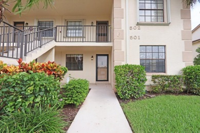 Corner first-floor unit with breathtaking golf course views! on The Golf Club of Jupiter in Florida - for sale on GolfHomes.com, golf home, golf lot