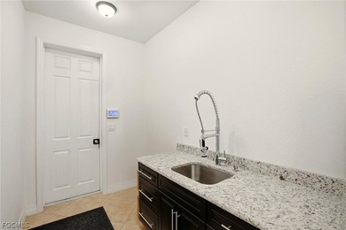 Look at this Custom-Built Stunning Luxury Two-Story Pool Home on Del Tura Golf and Country Club in Florida - for sale on GolfHomes.com, golf home, golf lot