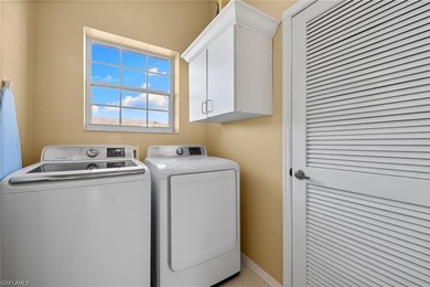 This spacious, well-designed second-floor end-unit is located in on Windstar on Naples Bay in Florida - for sale on GolfHomes.com, golf home, golf lot