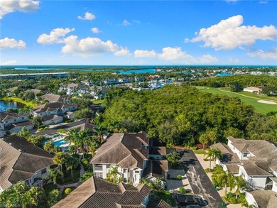 This spacious, well-designed second-floor end-unit is located in on Windstar on Naples Bay in Florida - for sale on GolfHomes.com, golf home, golf lot