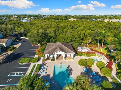 This spacious, well-designed second-floor end-unit is located in on Windstar on Naples Bay in Florida - for sale on GolfHomes.com, golf home, golf lot