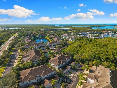 This spacious, well-designed second-floor end-unit is located in on Windstar on Naples Bay in Florida - for sale on GolfHomes.com, golf home, golf lot