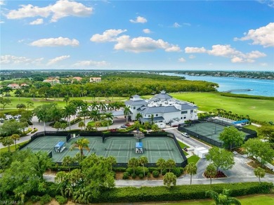 This spacious, well-designed second-floor end-unit is located in on Windstar on Naples Bay in Florida - for sale on GolfHomes.com, golf home, golf lot