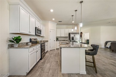 LIKE-NEW Roma Model home offering a bright, OPEN-CONCEPT DESIGN on Pelican Preserve Golf Club in Florida - for sale on GolfHomes.com, golf home, golf lot