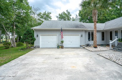 Spacious Coastal Retreat with Sunroom & Outdoor Entertaining on Brick Landing Plantation Yacht and Golf Club in North Carolina - for sale on GolfHomes.com, golf home, golf lot