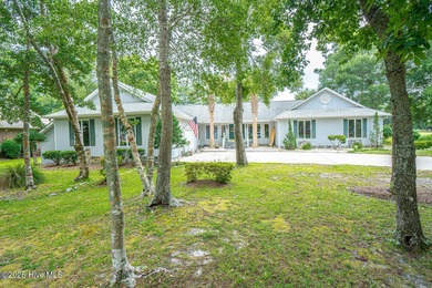 Spacious Coastal Retreat with Sunroom & Outdoor Entertaining on Brick Landing Plantation Yacht and Golf Club in North Carolina - for sale on GolfHomes.com, golf home, golf lot