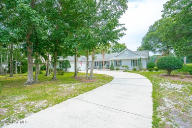 Spacious Coastal Retreat with Sunroom & Outdoor Entertaining on Brick Landing Plantation Yacht and Golf Club in North Carolina - for sale on GolfHomes.com, golf home, golf lot