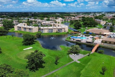 Wake up to tranquil water views in this stunning 2-bedroom on Sunrise Lakes Phase III in Florida - for sale on GolfHomes.com, golf home, golf lot