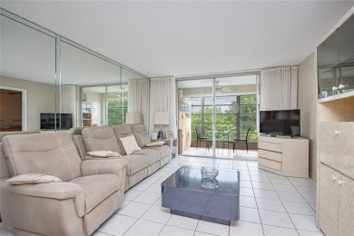 Wake up to tranquil water views in this stunning 2-bedroom on Sunrise Lakes Phase III in Florida - for sale on GolfHomes.com, golf home, golf lot