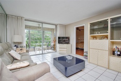 Wake up to tranquil water views in this stunning 2-bedroom on Sunrise Lakes Phase III in Florida - for sale on GolfHomes.com, golf home, golf lot