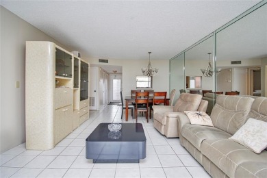 Wake up to tranquil water views in this stunning 2-bedroom on Sunrise Lakes Phase III in Florida - for sale on GolfHomes.com, golf home, golf lot