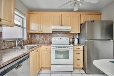 Wake up to tranquil water views in this stunning 2-bedroom on Sunrise Lakes Phase III in Florida - for sale on GolfHomes.com, golf home, golf lot