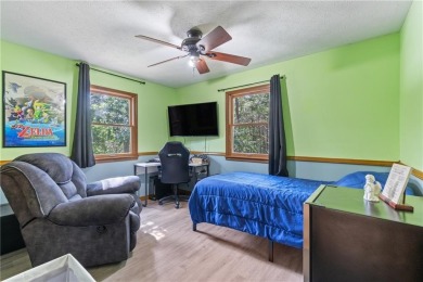 Set on a gently sloping, beautifully landscaped lot in a quiet on Holiday Island Executive Golf Course in Arkansas - for sale on GolfHomes.com, golf home, golf lot