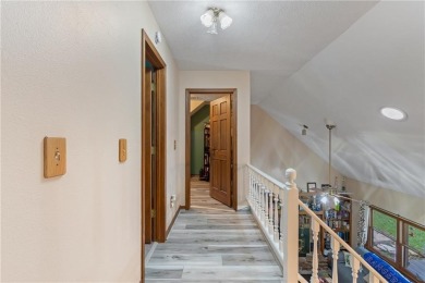 Set on a gently sloping, beautifully landscaped lot in a quiet on Holiday Island Executive Golf Course in Arkansas - for sale on GolfHomes.com, golf home, golf lot