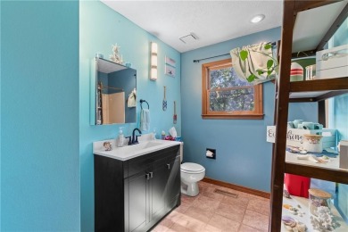 Set on a gently sloping, beautifully landscaped lot in a quiet on Holiday Island Executive Golf Course in Arkansas - for sale on GolfHomes.com, golf home, golf lot