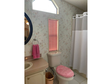 Welcome to this charming, fully furnished home in the desirable on Sabal Springs Golf and Racquet Club in Florida - for sale on GolfHomes.com, golf home, golf lot