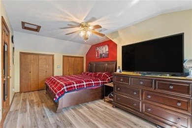 Set on a gently sloping, beautifully landscaped lot in a quiet on Holiday Island Executive Golf Course in Arkansas - for sale on GolfHomes.com, golf home, golf lot