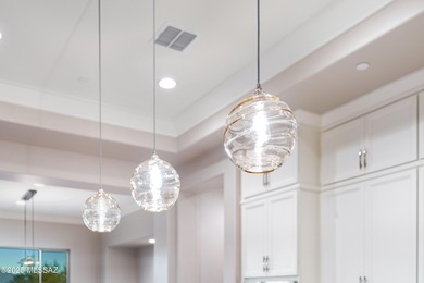 This exceptional 2024 residence presents 3 bedrooms, 2.5 baths on Quail Creek Country Club  in Arizona - for sale on GolfHomes.com, golf home, golf lot