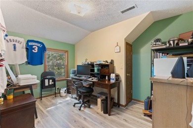 Set on a gently sloping, beautifully landscaped lot in a quiet on Holiday Island Executive Golf Course in Arkansas - for sale on GolfHomes.com, golf home, golf lot
