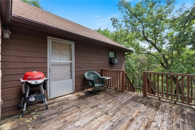Set on a gently sloping, beautifully landscaped lot in a quiet on Holiday Island Executive Golf Course in Arkansas - for sale on GolfHomes.com, golf home, golf lot
