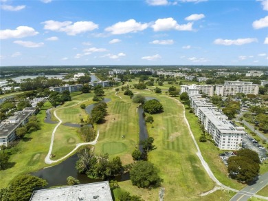 Stunning condo with expansive views of the golf course on Palm-Aire Country Club and Resort - Palms in Florida - for sale on GolfHomes.com, golf home, golf lot