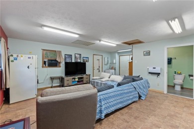 Set on a gently sloping, beautifully landscaped lot in a quiet on Holiday Island Executive Golf Course in Arkansas - for sale on GolfHomes.com, golf home, golf lot