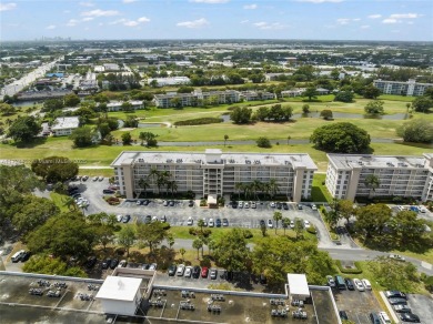 Stunning condo with expansive views of the golf course on Palm-Aire Country Club and Resort - Palms in Florida - for sale on GolfHomes.com, golf home, golf lot