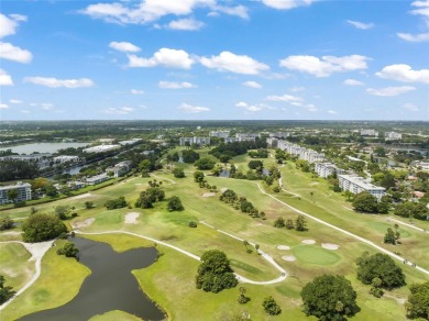 Stunning condo with expansive views of the golf course on Palm-Aire Country Club and Resort - Palms in Florida - for sale on GolfHomes.com, golf home, golf lot