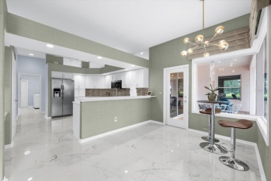 Find your sanctuary in a home where stunning lake views provide on Misty Creek Country Club in Florida - for sale on GolfHomes.com, golf home, golf lot