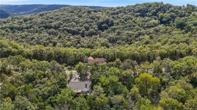 Set on a gently sloping, beautifully landscaped lot in a quiet on Holiday Island Executive Golf Course in Arkansas - for sale on GolfHomes.com, golf home, golf lot
