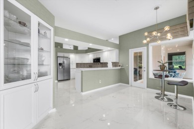 Find your sanctuary in a home where stunning lake views provide on Misty Creek Country Club in Florida - for sale on GolfHomes.com, golf home, golf lot
