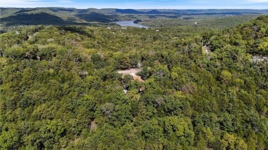 Set on a gently sloping, beautifully landscaped lot in a quiet on Holiday Island Executive Golf Course in Arkansas - for sale on GolfHomes.com, golf home, golf lot