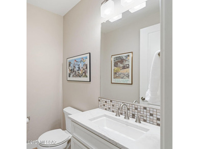 This exceptional 2024 residence presents 3 bedrooms, 2.5 baths on Quail Creek Country Club  in Arizona - for sale on GolfHomes.com, golf home, golf lot